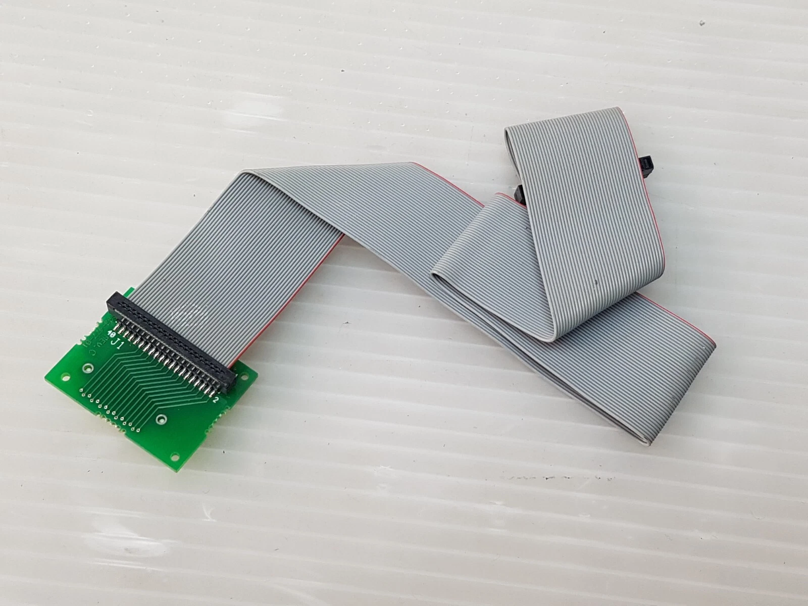 0633-478-01 adapter board from the connector side, with the folded ribbon cable