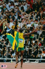 USAIN BOLT SIGNED 12x8 OLYMPICS LEGEND JAMAICA PHOTO (ACG CERT AG16768)
