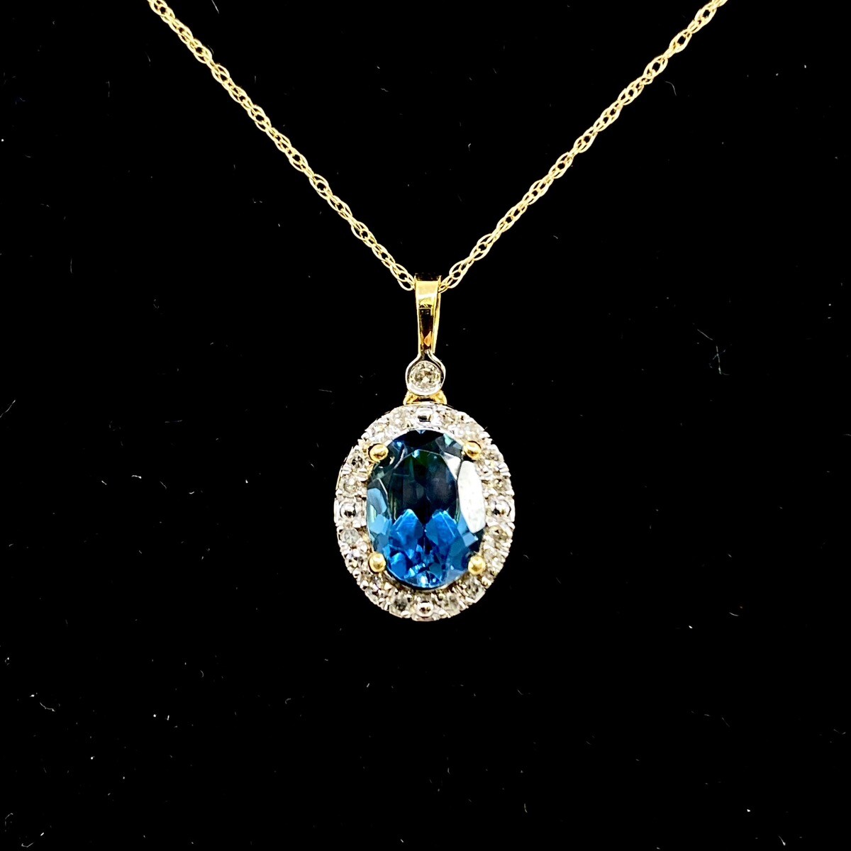 10K Yellow Gold Oval Blue Topaz & 0.15ctw Diamond Halo 18 10K Yellow Gold Oval Blue Topaz & 0.15ctw Diamond Halo 18