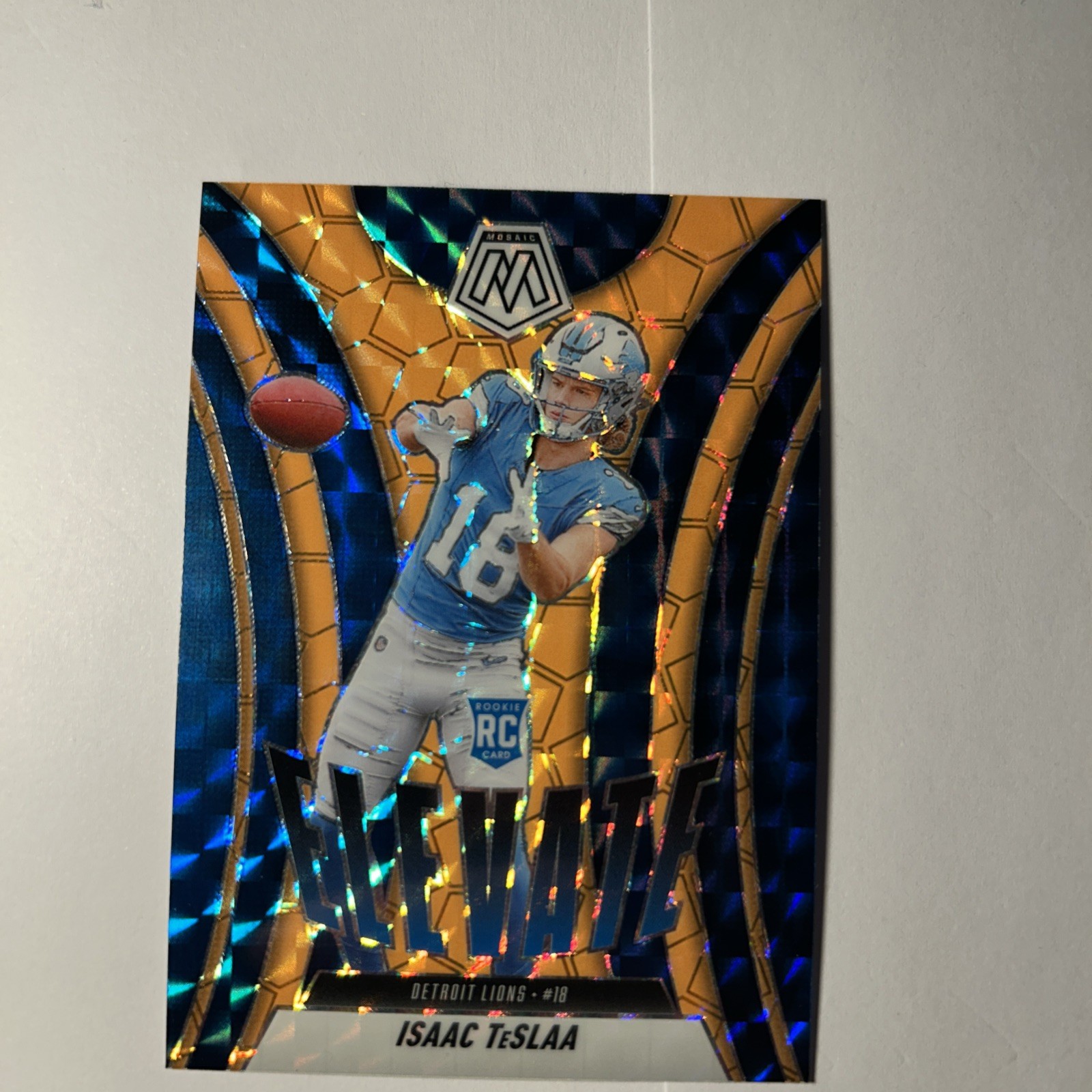 2025 Panini Mosaic Elevate Isaac Teslaa #8 Orange Fluorescent Mosaic Prizm (RC)