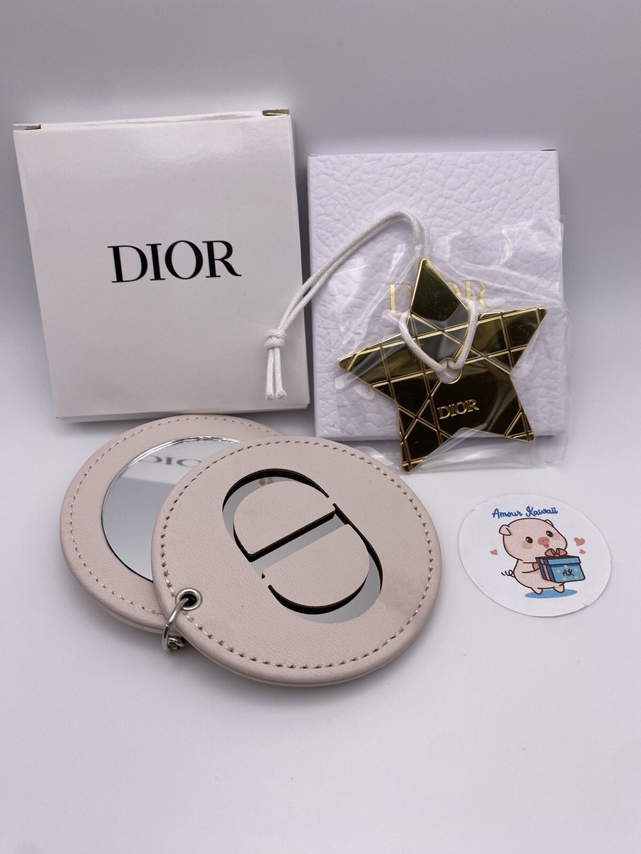 Dior rare gold tone 2023 star charm & keychain mirror in a Dior rare gold tone 2023 star charm & keychain mirror in a