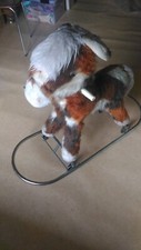 Jouet cheval à roulette et