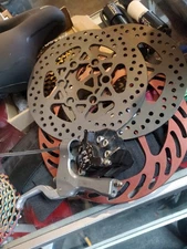 Pro FM Stop hydraulic Mountain cycles disc brake caliper, lever and some rotors.