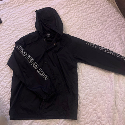 OBEY Men s Black Hooded Windbreaker Jacket Snap Closure Logo Nylon Size L