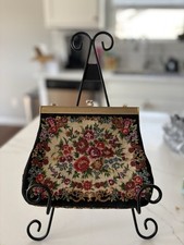 Vintage embroidered floral tapestry frame evening bag with brass hardware.