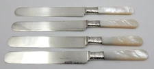4 ANTIQUE MERIDEN CUTLERY MOTHER OF PEARL KNIVES WITH STERLING SILVER BOLSTERS