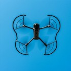Black Mavic 3 drone with four open propellers guarded by lightweight black and silver fan blades on a blue background.