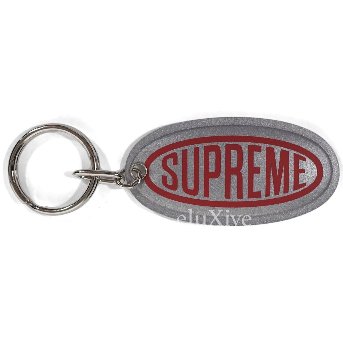 NWT Supreme NY Silver Red 3M Reflective Oval Logo Print Keychain FW18 AUTHENTIC NWT Supreme NY Silver Red 3M Reflective Oval Logo Print Keychain FW18 AUTHENTIC