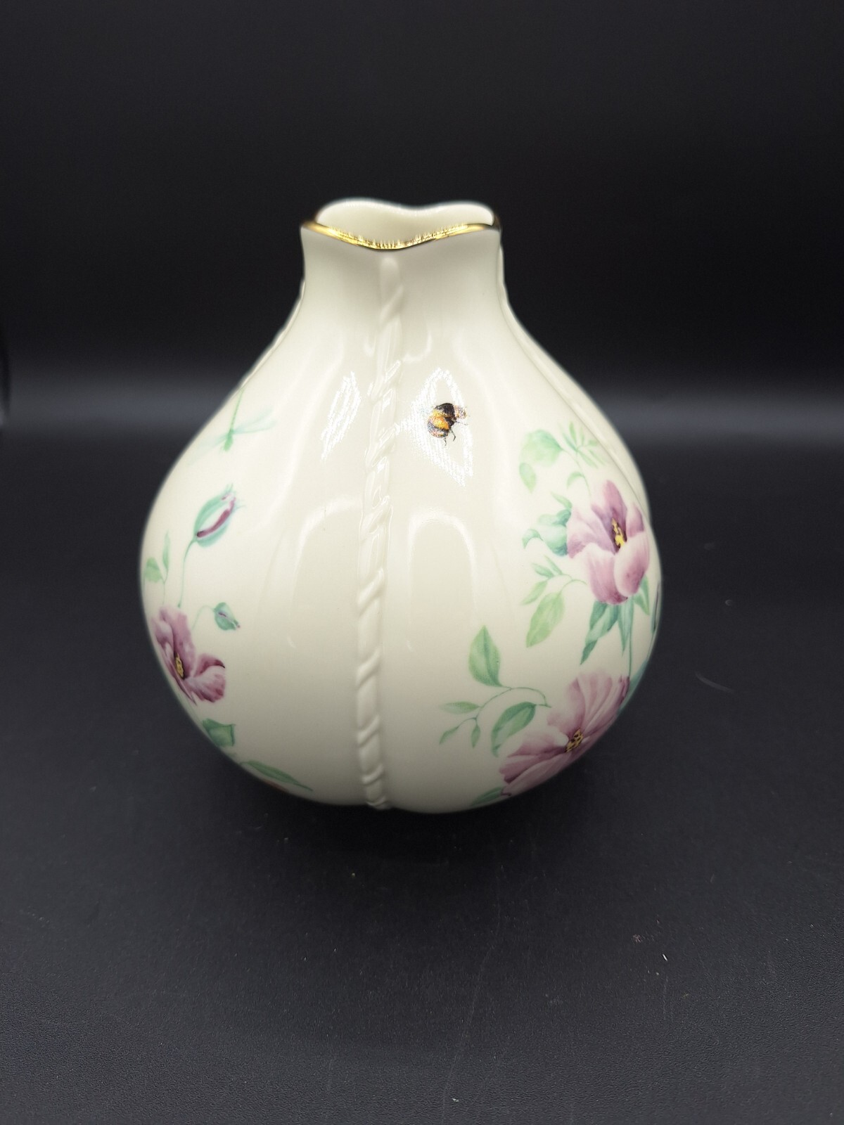 Cream round LENOX MORNINGSIDE vase with gold rim, bee, dragonflies, and purple floral accents on black background.