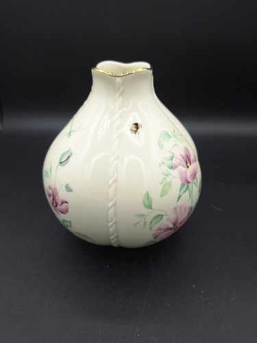 Cream round LENOX MORNINGSIDE vase with gold rim, bee, dragonflies, and purple floral accents on black background.