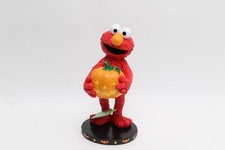Sesame Street Elmo holding pumpkin Halloween