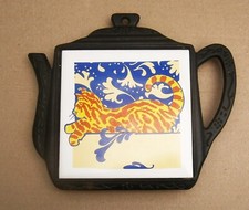 V501)  Vintage cast iron cat tile teapot shaped trivet