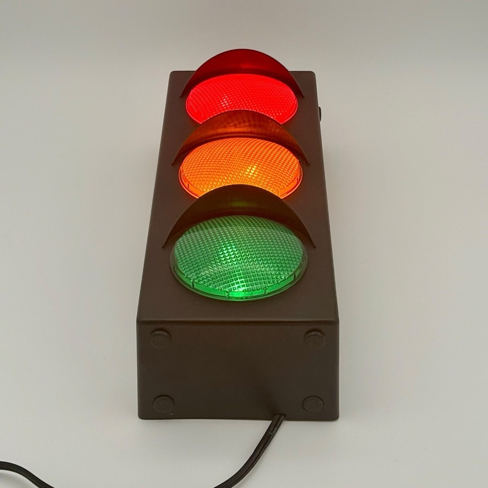 A vintage Lava World stoplight lamp that actually cycles through red/yellow/green — instant man-cave centerpiece with serious retro credentials.