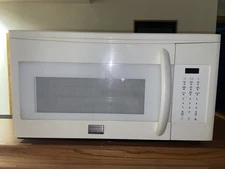 Frigidaire Over-the-Range Microwave in Bisque, model, Used.