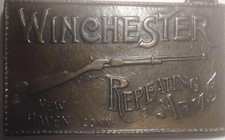 Solid brass Winchester Repeating Arms belt buckle, measures 2.25 x 3.75 inches