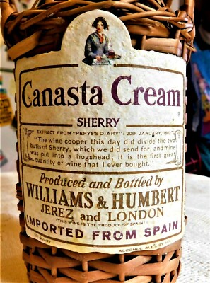 VINTAGE MID-20th CENTURY CANASTA CREAM SHERRY BOTTLE IN WICKER