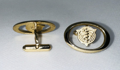 A pair of vintage gold-plated Cuff Links Related To Dentistry Mid 20th Century 