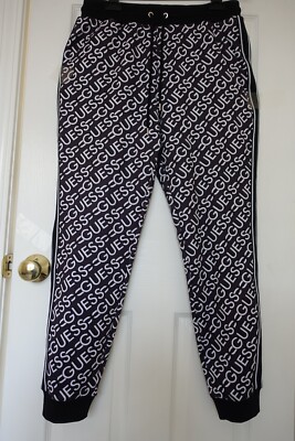 NWT WOMENS GUESS ALL OVER PRINT LOGO BLACK PANTS SIZE L $59.99