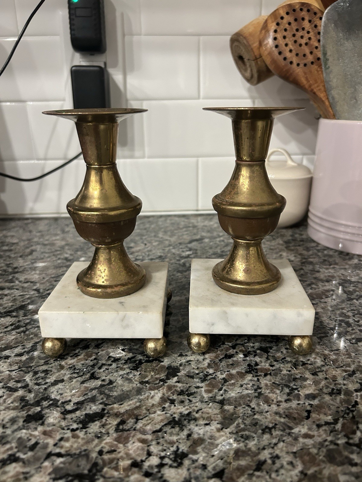 Pair of vintage brass candlestick holders on wood-trimmed marble bases