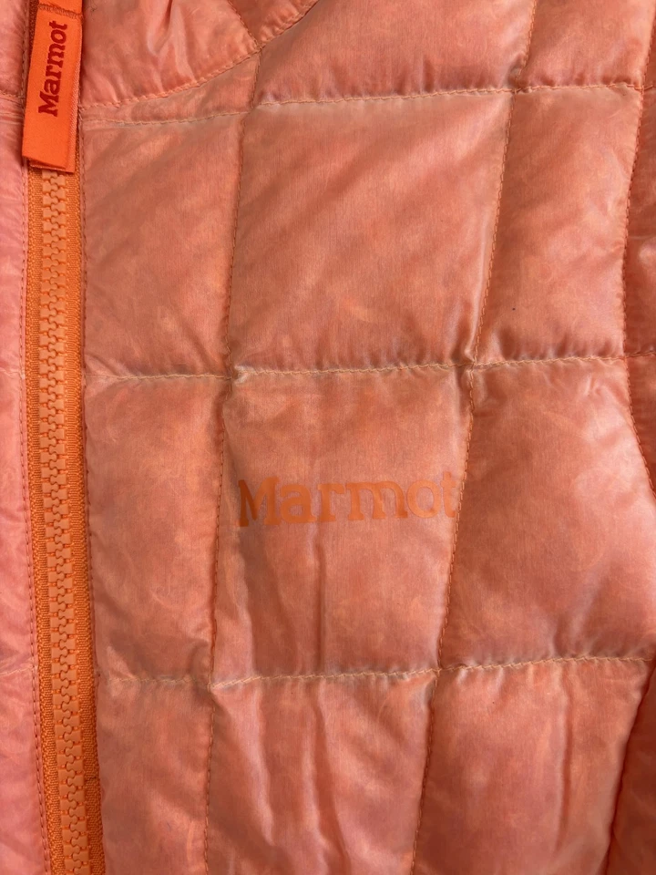 Chaleco Marmot Juvenil Medio Naranja Acolchado Plumón de Pato Aislado Ligero Puffer Foto 2 de 4