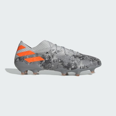 orange and white soccer cleats