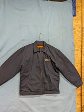 work jacket made by red cap has pilot transportation logo on it ..color is blue