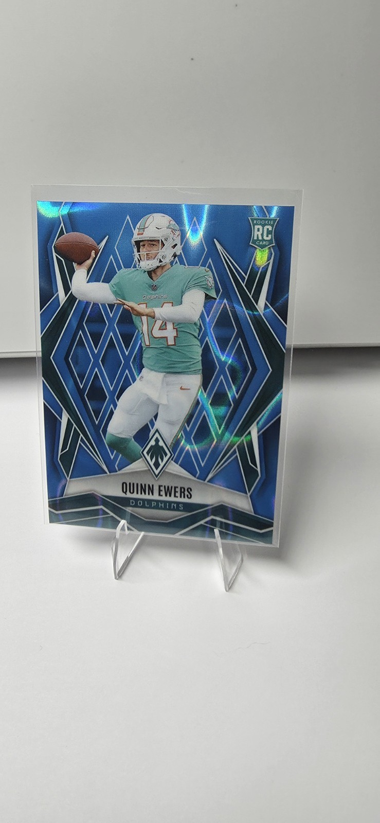 2025 Panini Phoenix - Rookies Quinn Ewers #159 Light Blue Lava /325 (RC)