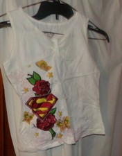 1 LOTE DE 2 TOPS SIN MANGAS NIÑAS 10/12 NUEVOS CON ETIQUETAS 1 DC COMICS BLANCO SUPERGIRL/1 ARIZON