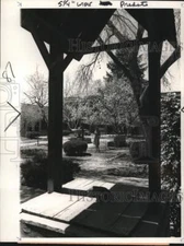 1965 Press Photo Old well frames stroller in Sena business plaza in Santa Fe, NM