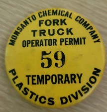 vintage yellow pinback button that served as a Monsanto Chemical Company Fork
