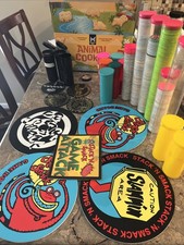 1990 s pogs lot of over 1400 with 8 pads 17 containers