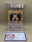 New ListingVintage Wotc 1999 Pokemon Base Set  Alakazam Holo 1/102 BGS 8 Beckett