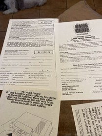 Lot of 4 Game Genie NES Nintendo system Inserts Registration Card