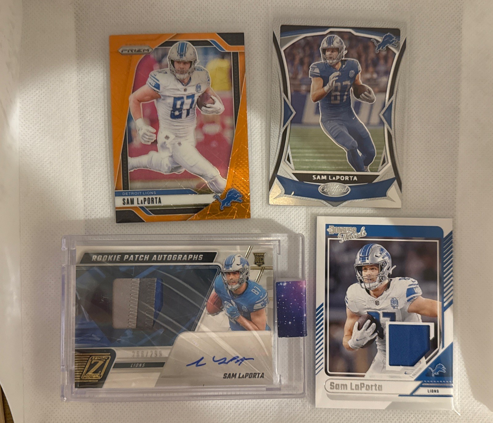 2023 Panini Zenith Sam LaPorta Patch RC Auto /299 Lions Encased + 3 Other Cards