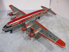 DC 7 NORTHWEST AIRLINES Friction Powered with turning Props Made In Japan