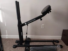 The DB Method Squat Workout Exercise Machine includes a 25lb. weight belt