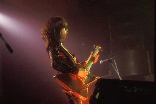 English Rock musician Pete Willis of the group Def Leppard plays g- Old Photo