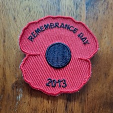 Remembrance Day poppy patch featuring the year 2013.