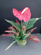 Deep red artificial anthurium table decoration. tropical flowers
