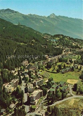 CRANS-MONTANA VS aerial photo spa hotels mountains forests pasture cows Alps