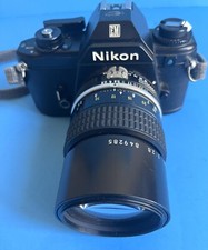 Nikon EM 35mm film camera with Nikkor 136mm F/ 1.28 lens