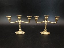Pair of very small 3 armed metal candlesticks