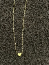 Tiny heart necklace. Gold color. 16-18 inches.