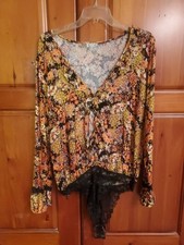 Women NWOT "Intimately" orange' blk floral long sleeve bodysuit. Size Large