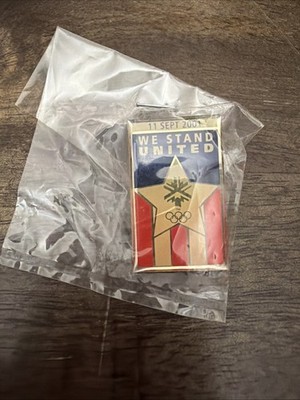 Sept 11, 2001 We stand United Olympic US Flag Lapel/hat pin - New in Plastic