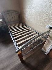 А Single Metal Bed With Wooden Elements, In Very Good Condition.