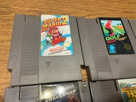 Lot of 8 Nintendo NES games including Mega Man 2 And 3 Mario 2 And 3 WWF Etc