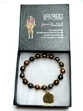NEW NIB UGLY BETTY BOY CRUSH QUALITY HEAVIER ELASTIC BRACELET W/CHARM GOLD TONE