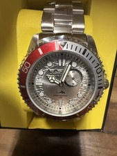 Invicta Men's Pro Diver With a 43 mm Case Size Silver Dial. Silver, Red Bezel