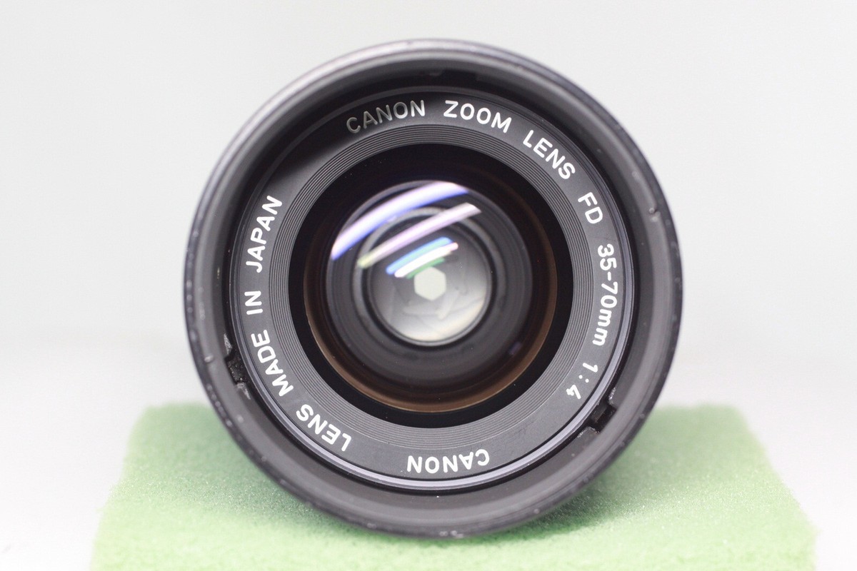 Canon AE-1 35mm SLR Film Camera + New FD 35-70mm F/4 Zoom Canon AE-1 35mm SLR Film Camera + New FD 35-70mm F/4 Zoom